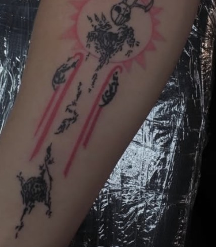 Blackwork and red tattoo