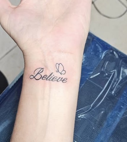 Believe script tattoo by Lazaro