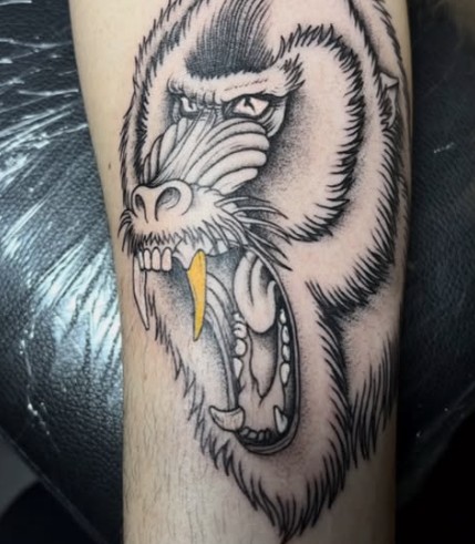 Black and grey baboon tattoo
